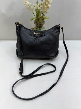 Coach Ashley black leather crossbody bag featuring snakeskin embossed detailing
